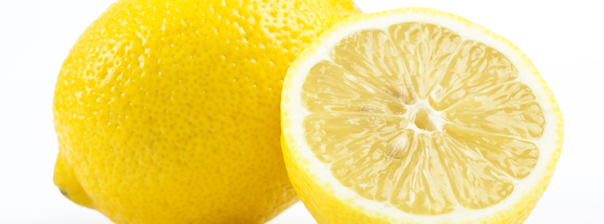 A whole lemon next to a half lemon