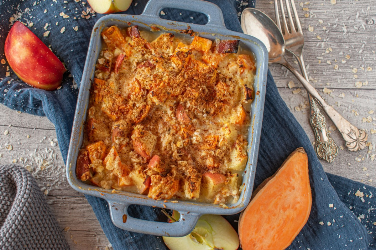 A casserole dish containing sweet potato and apple bake