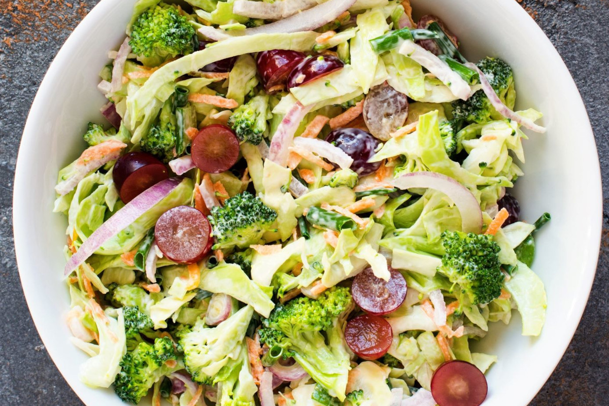A bowl of broccoli grape salad