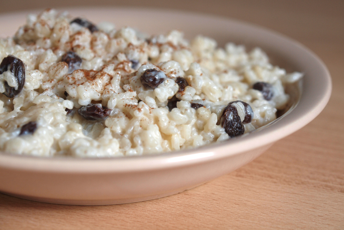 A bowl of rice pudding with raisins