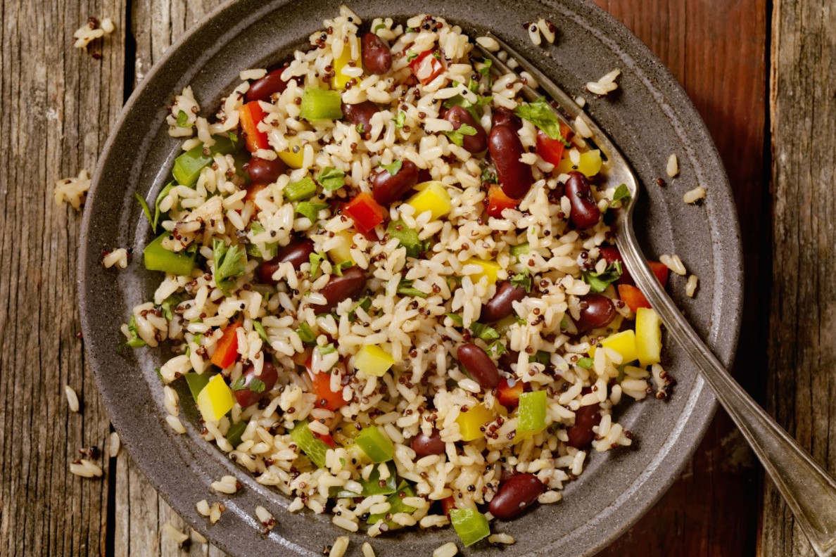 A plate of rice with beans and vegetables