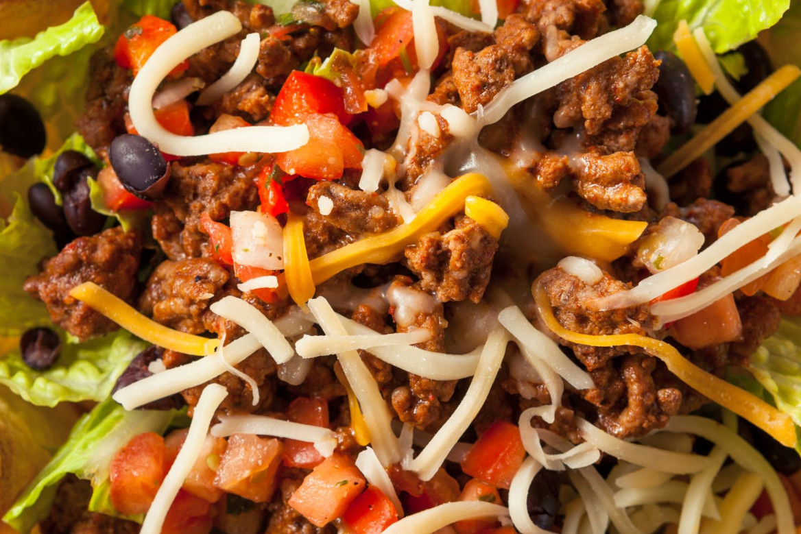 Ground beef, shredded cheese, tomatoes, lettuce and black beans