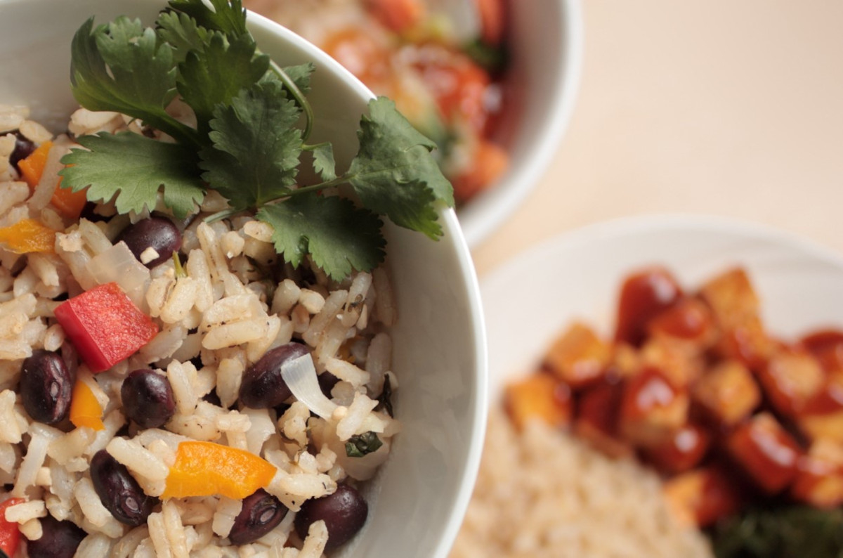 A bowl of rice and beans garnished with cilantro