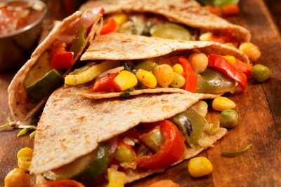 Tortillas filled with corn and bell peppers