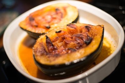 A dish with baked stuffed acorn squash